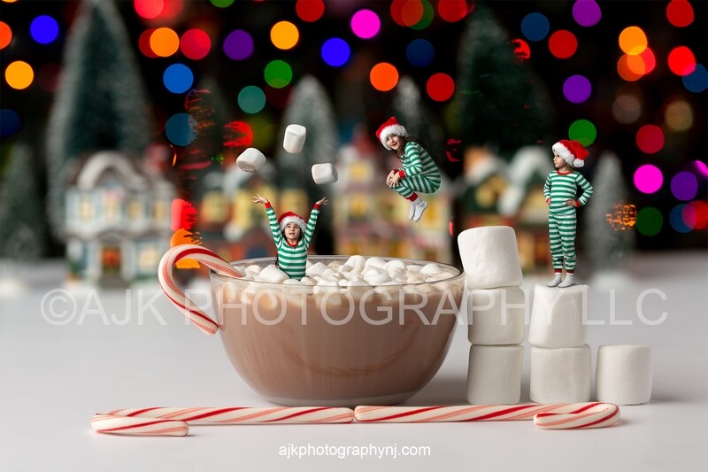 Christmas digital backdrop, hot chocolate in bowl with candy canes and marshmallows, Christmas lights and trees in back, digital background