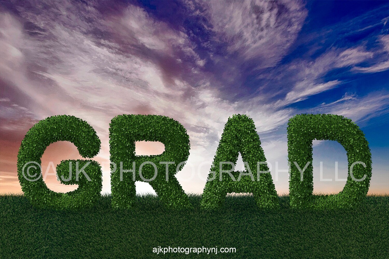 Giant bush letters spelling GRAD in grassy field and blue sky, Graduation digital backdrop