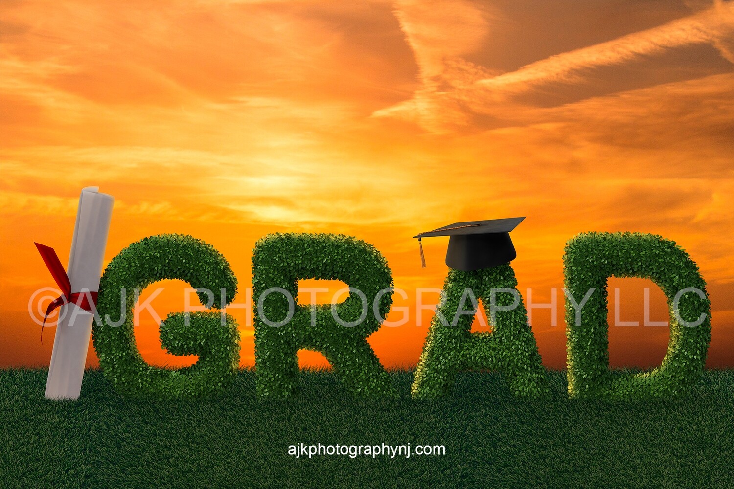 Giant bush letters spelling GRAD with a giant diploma against the G and giant graduation cap on the A in grassy field and gold sky, Graduation digital backdrop