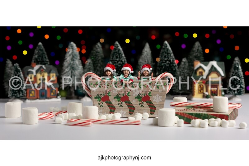 Children in Christmas box with candy canes and marshmallows digital backdrop
