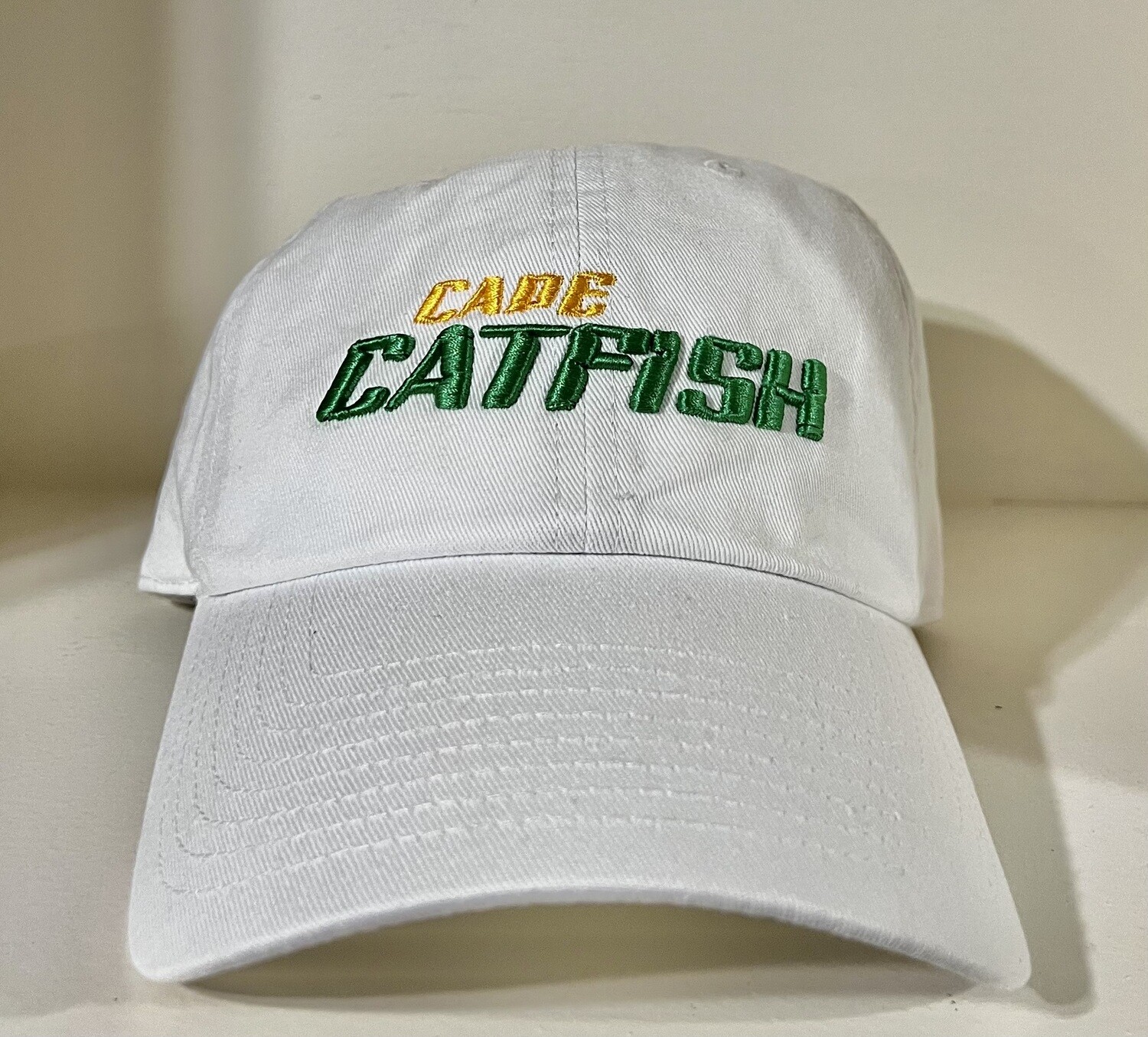 47' White Clean Up Hat w/ Kelly Green and Gold Catfish Word mark