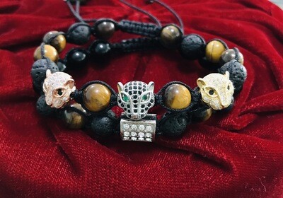 Juego, Panteras con incrustaciones de Zirconia con piedra Volcánica y Ojo de Tigre.