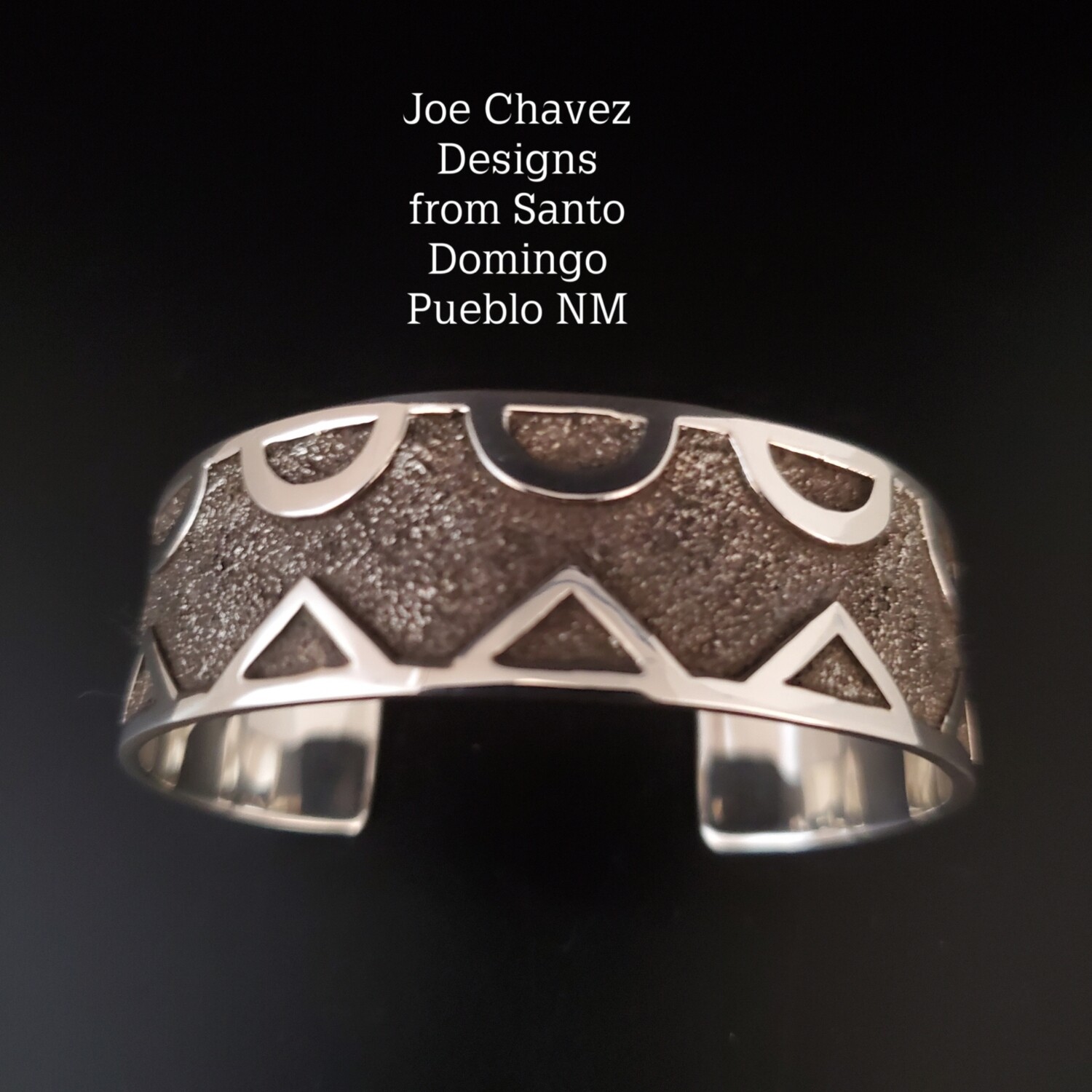 Sterling silver "Overlay " cuff with traditional Pueblo Cloud & Mountain symbols 