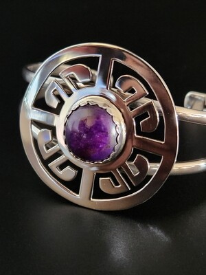 Sterling silver bracelet with natural high-quality Sugilite stone.  Traditional Pueblo cloud symbol