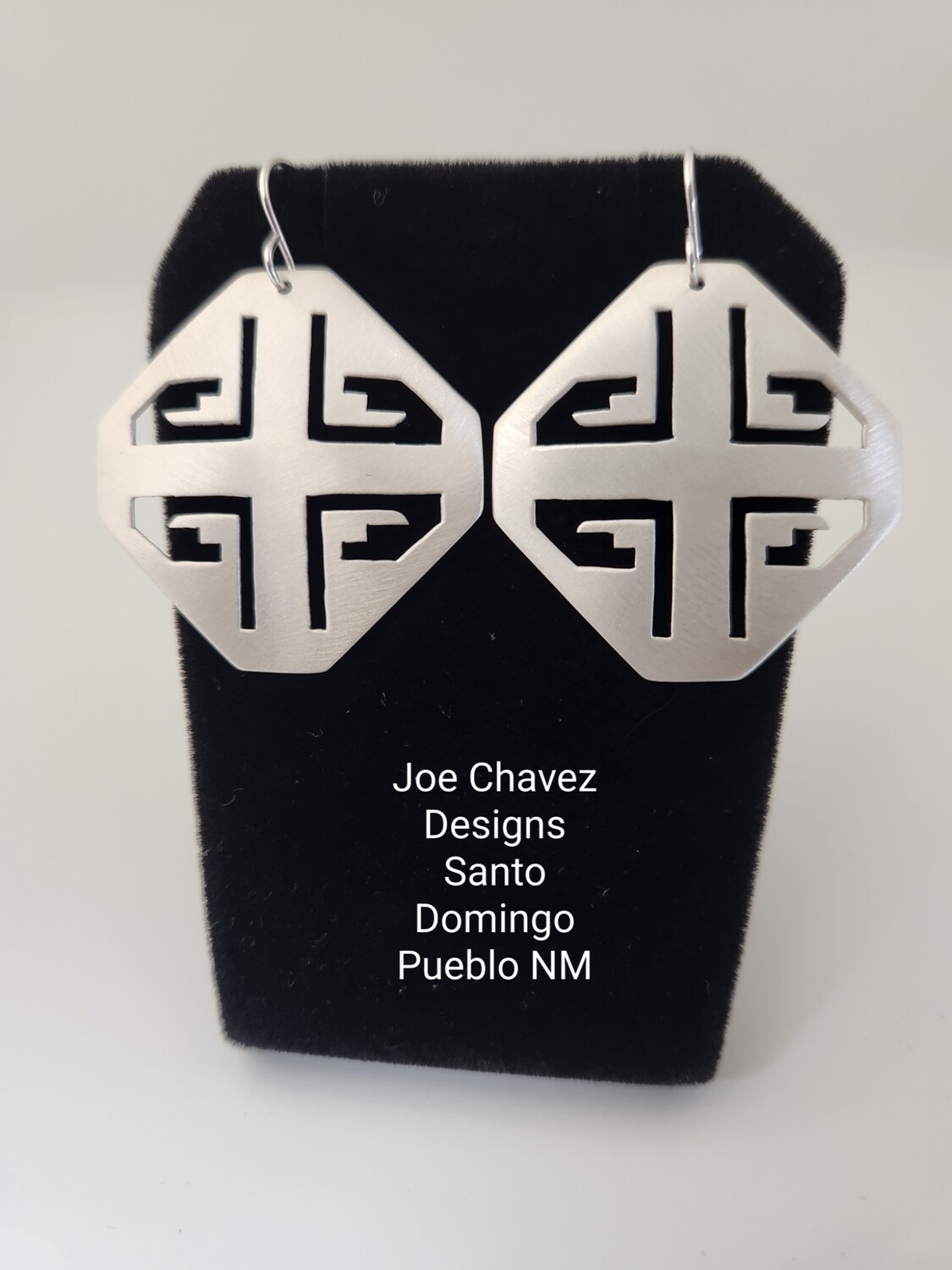 Sterling silver earrings with traditional Pueblo symbols