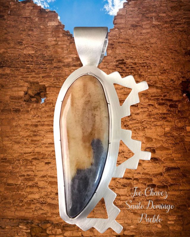 Sterling silver pendant with natural Picasso Marble stone, traditional Pueblo symbols