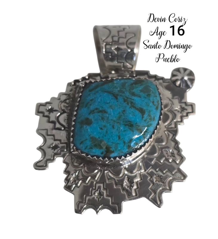 Sterling silver pendant with Kingman turquoise stone and stampwork designs