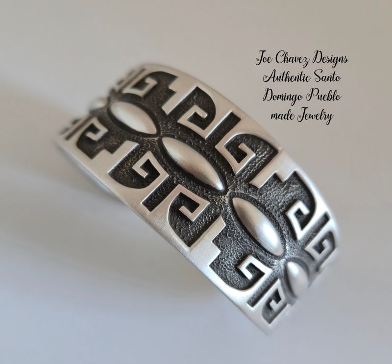 Sterling silver Overlay &amp; Repoussé cuff with traditional Pueblo symbols