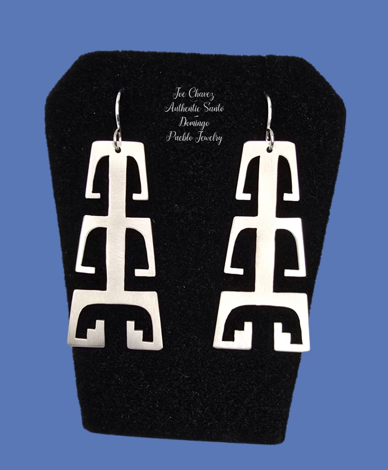 Sterling silver "cutout" earrings with traditional Pueblo symbols