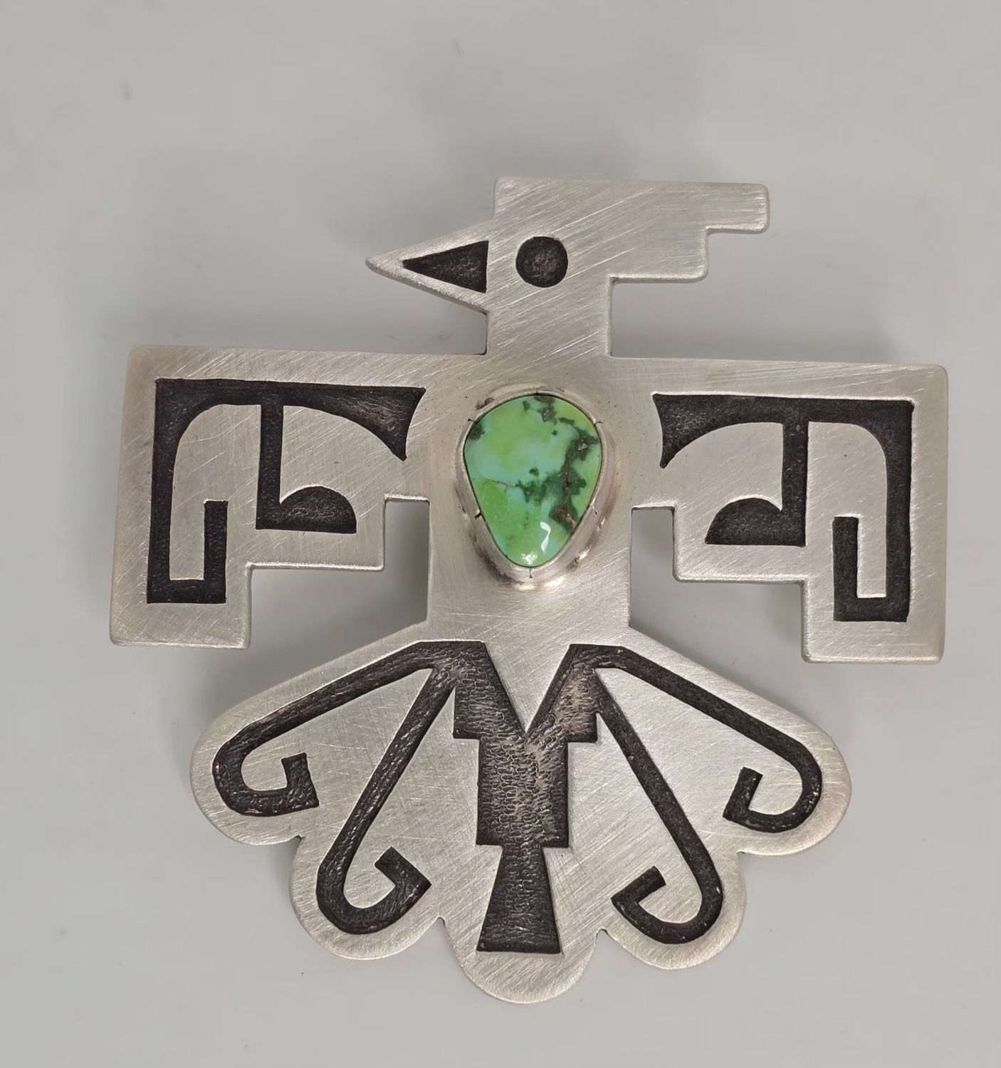 Sterling silver Overlay Santo Domingo Pueblo Thunderbird Pendent with natural Carico Lake turquoise and Shepard hook.