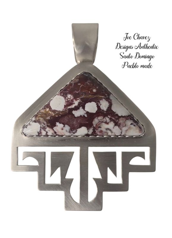 Sterling silver brushed finish pendant with natural Wildhorse stone.  Traditional Pueblo symbols