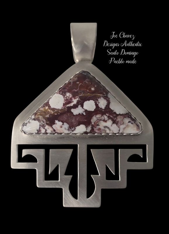 Sterling silver brushed finish pendant with natural Wildhorse stone.  Traditional Pueblo symbols