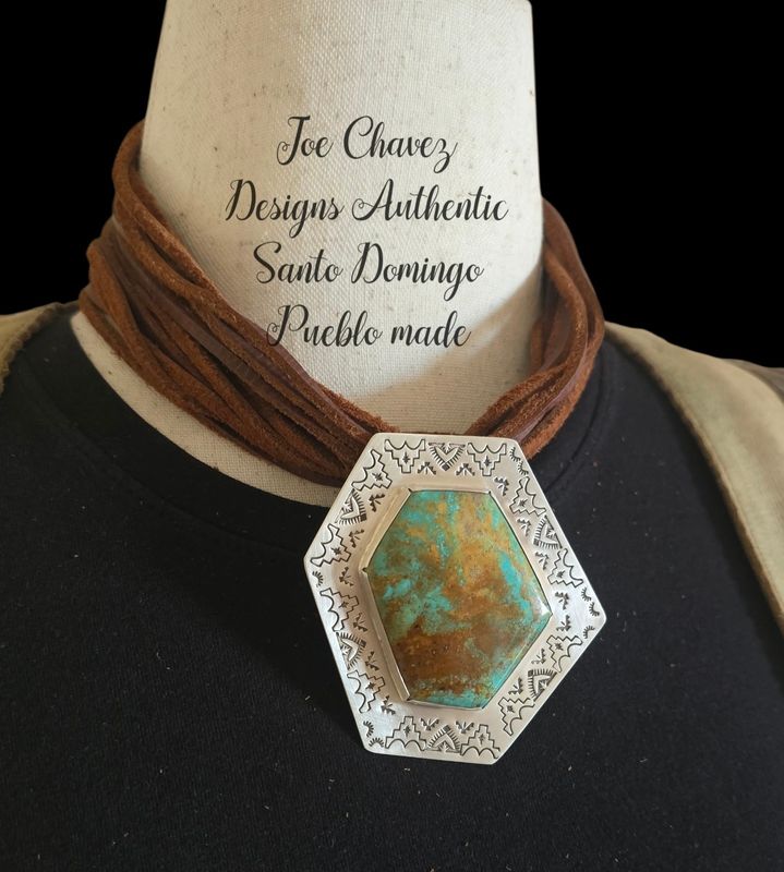 Sterling silver pendant with Kingman turquoise and stampwork designs and Shepard hook 