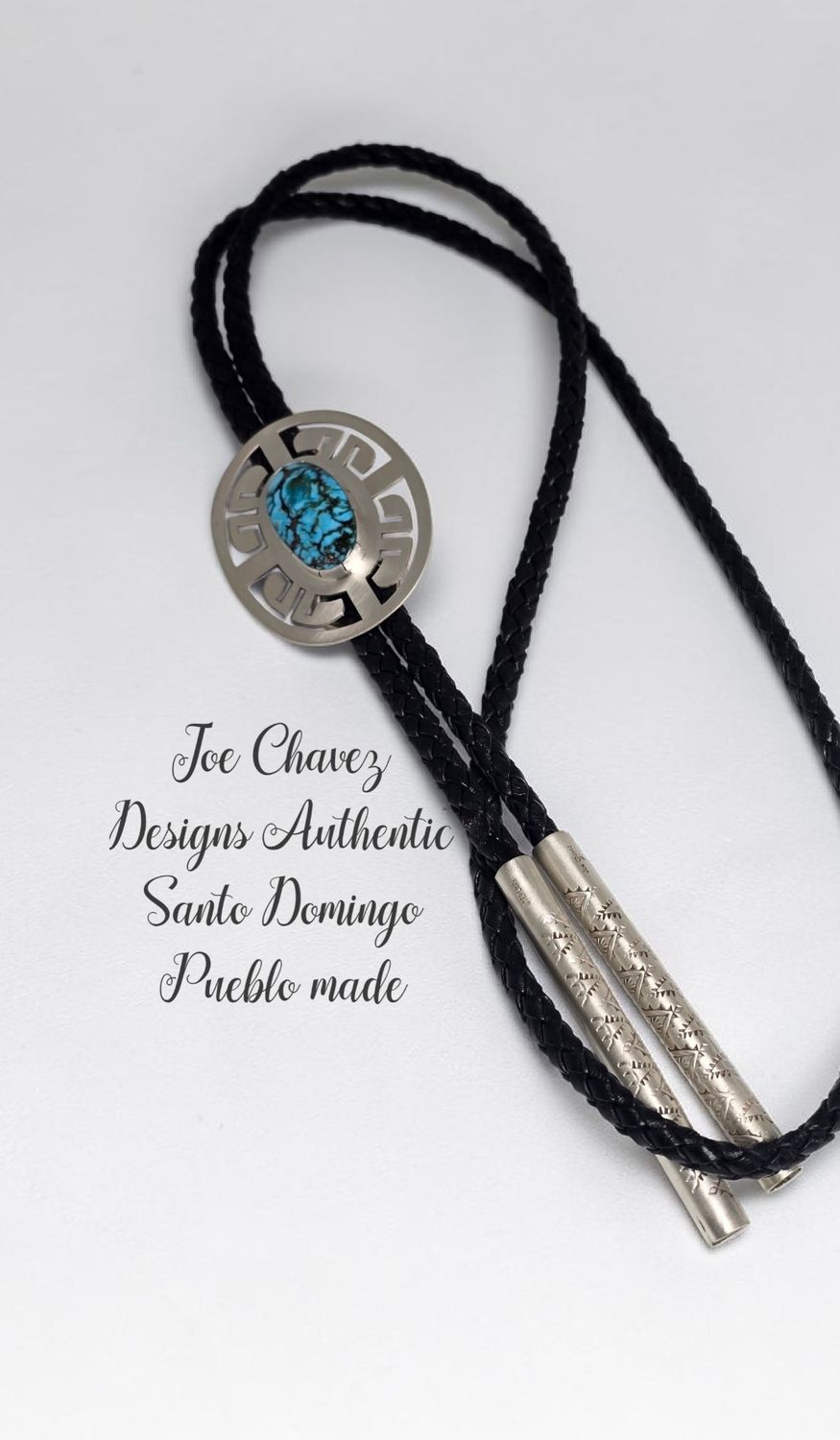 Sterling silver Bolo with high-quality Kingman turquoise stone. Traditional Pueblo symbols