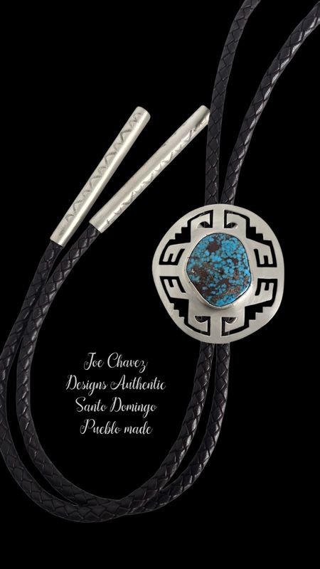 Sterling silver bolo tie with high-grade Kingman turquoise stone and traditional Pueblo symbols