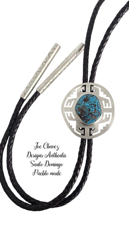 Sterling silver bolo tie with high-grade Kingman turquoise stone and traditional Pueblo symbols