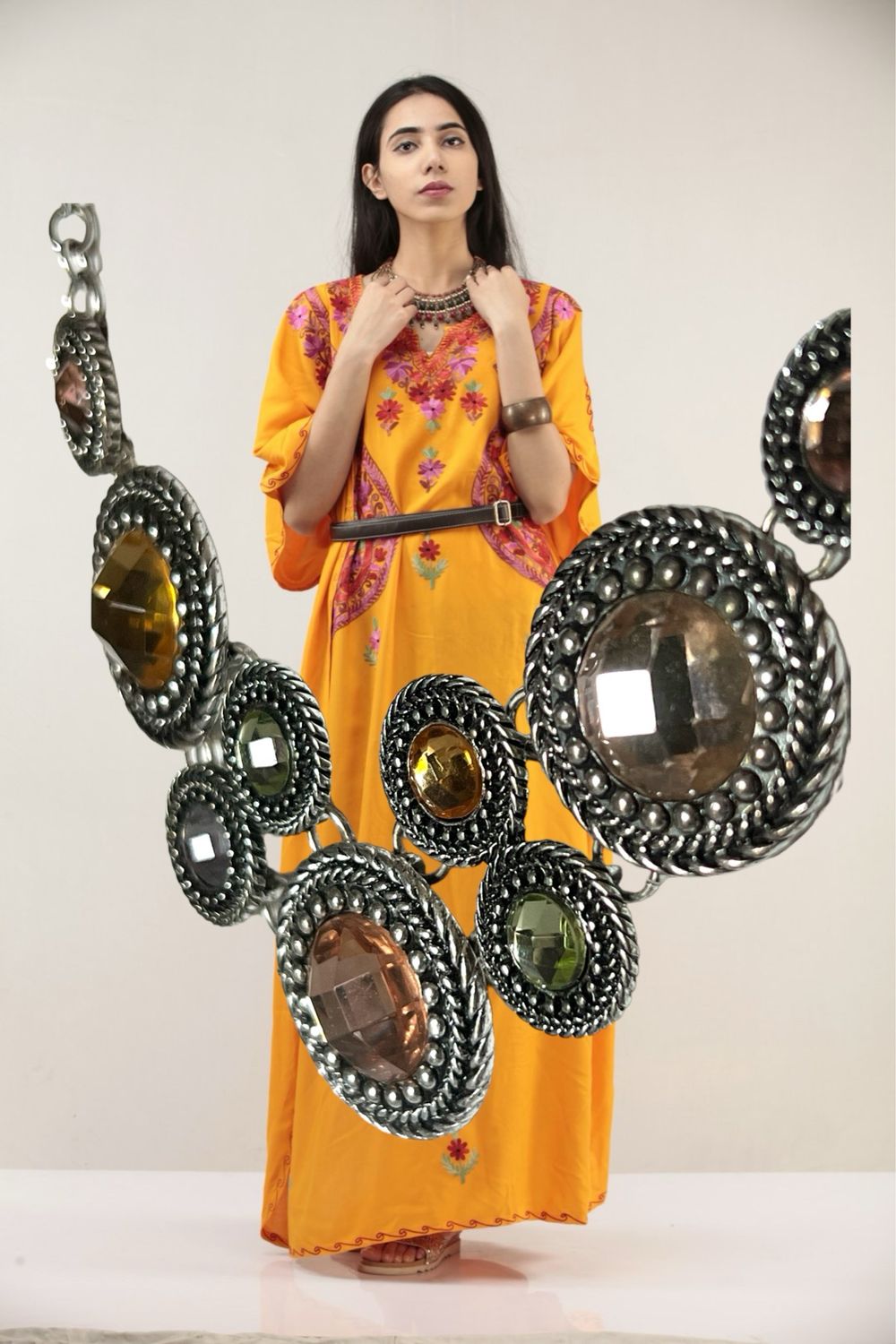 Premier Designs offers a stunning statement necklace that features multi-color glass stones.
