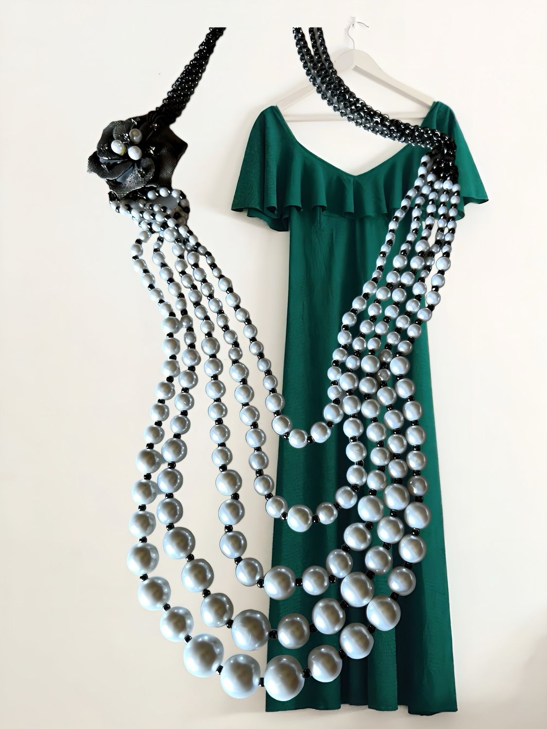 Statement Necklace With Faux Pearls Attached To Four Black Chain-Links with side flower medallion with pearls and black crystals