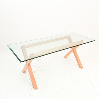 Wooden dining table with glass top