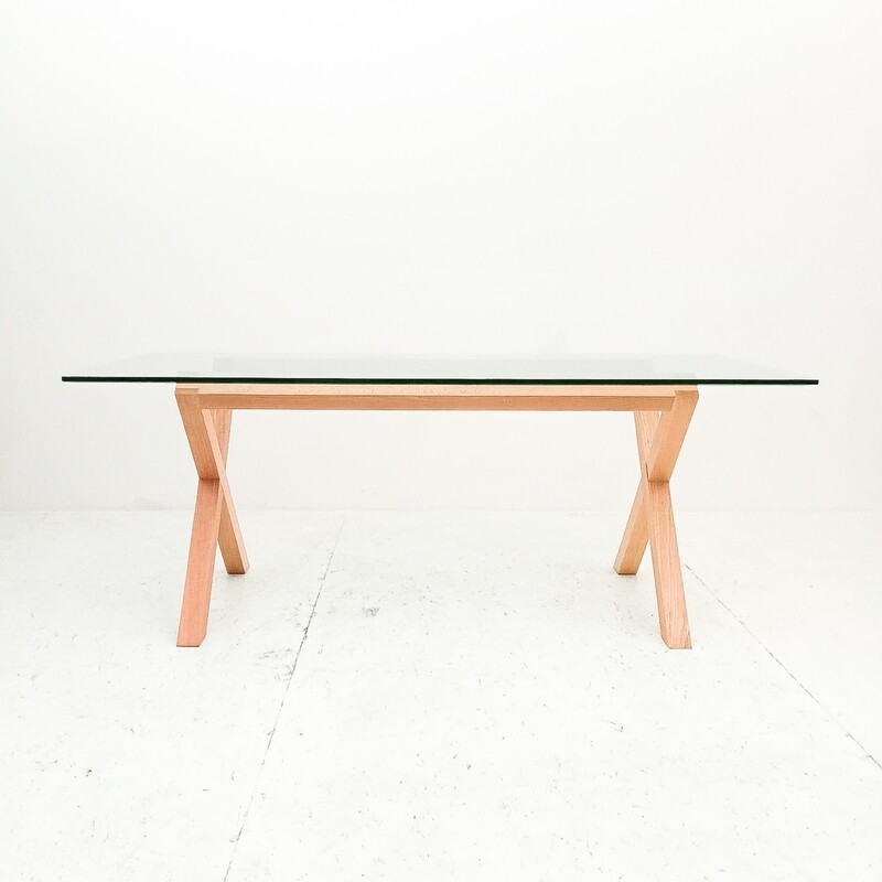 Wooden dining table with glass top