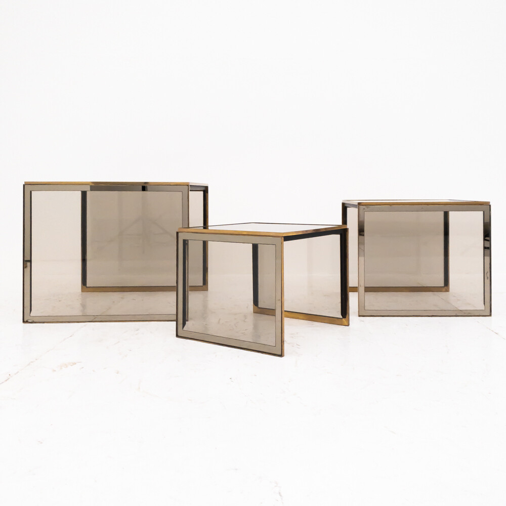 Nesting tables in brass and smoked glass, set of three Italy 60s