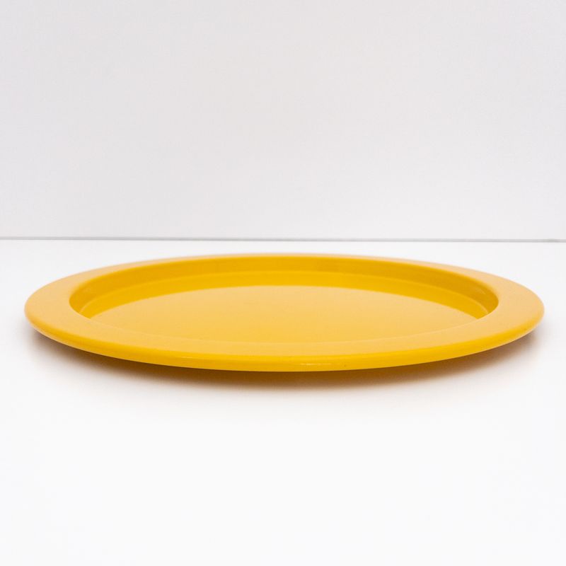 Alessi vintage tray underplate in saffron yellow painted metal, designed by Stefano Giovannoni, 1980s