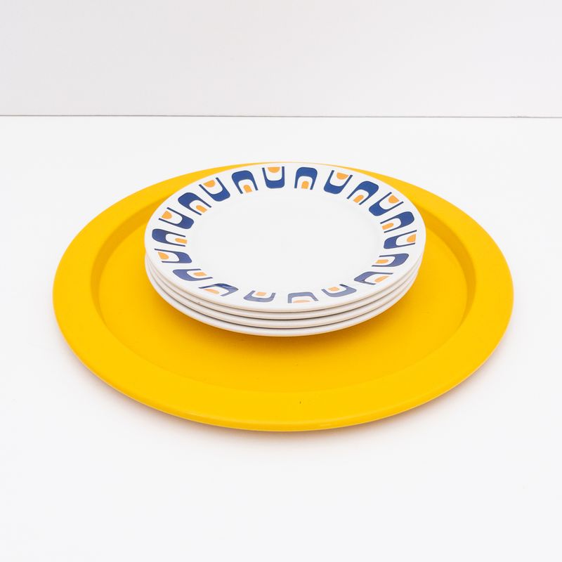 Alessi vintage tray underplate in saffron yellow painted metal, designed by Stefano Giovannoni, 1980s