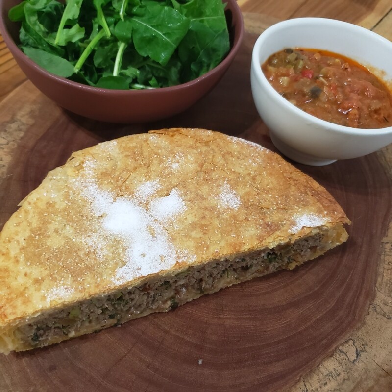 Kefta Pastilla, sweet savory meat pie done with leaves of dough similar to phyllo, ground beef, raisin, shawarma spices, confectioners sugar, mixed green salad. Kefta Pastilla, sweet savory meat pie done with leaves of dough similar to phyllo, ground beef, raisin, shawarma spices, confectioners sugar, mixed green salad.
