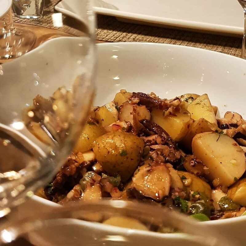 Octopus salad, mini potatoes, kalamata olives and cappers, red pesto, red onions and parsley, balsamic dressing. 
Gf, lf