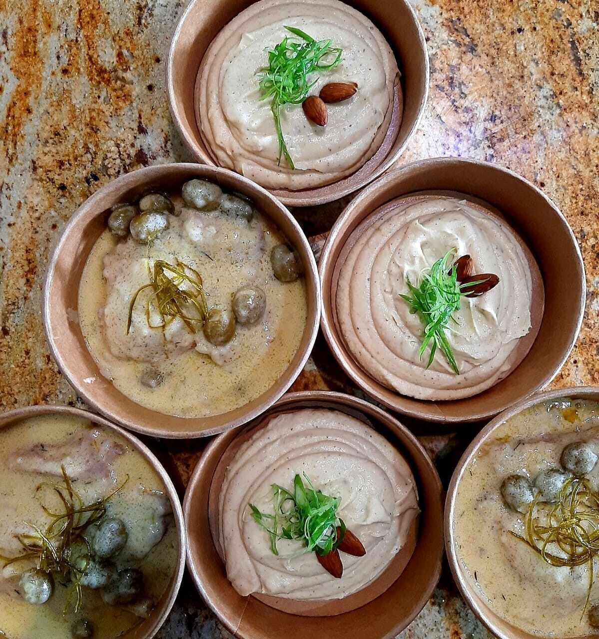 Braised rabit, green olive and white wine sauce, cauliflour almond puree, preserved lemon zests. K