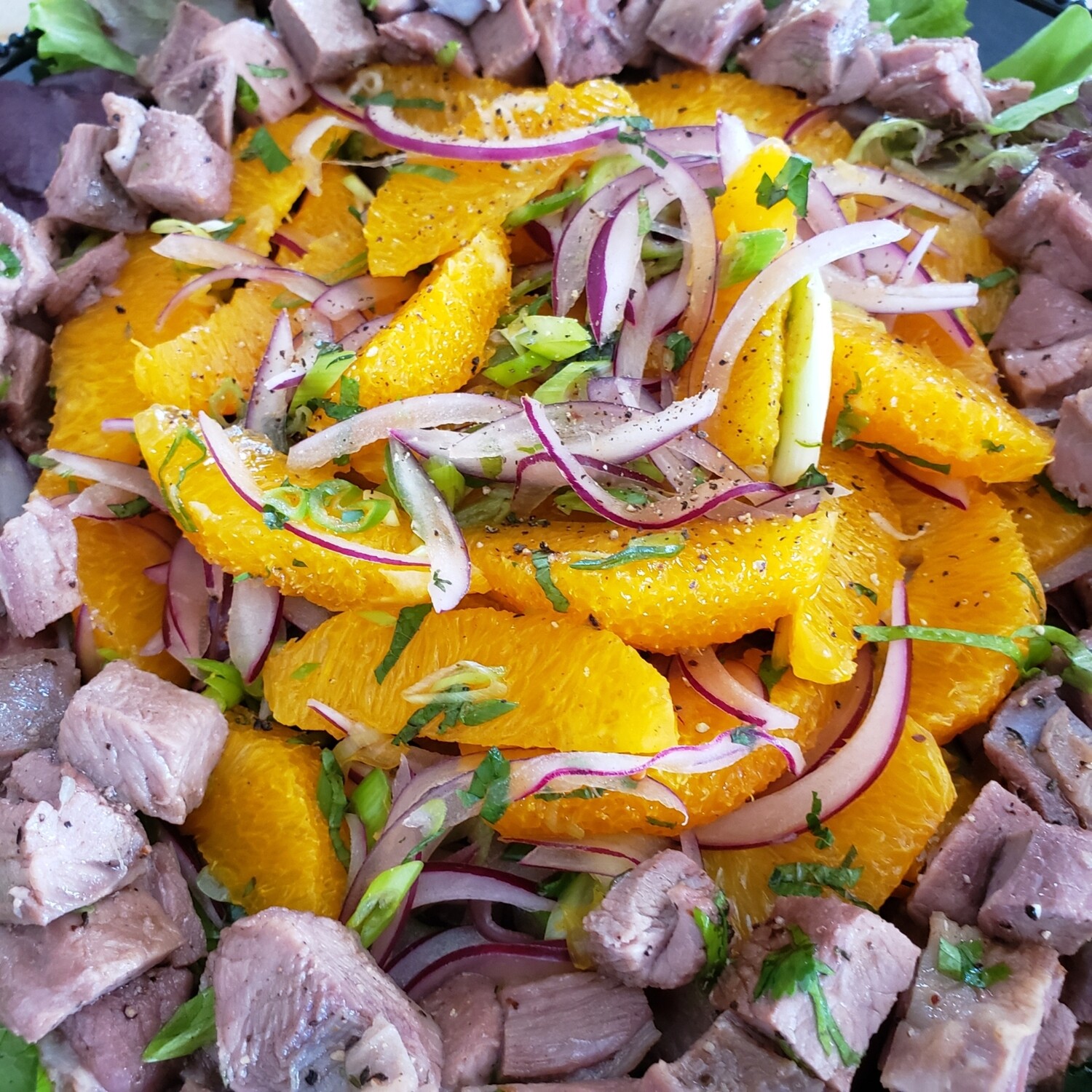 Orientals lamb, citrus and mint salad, side of yogurt sauce and harissa. Gf, k