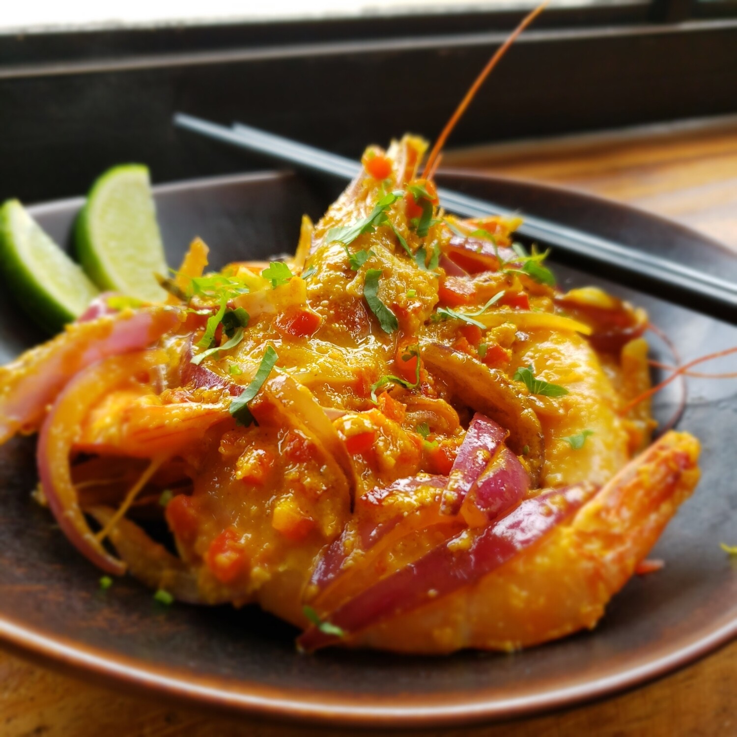 Seared Jumbo Shrimps, aji parmesan cream sauce, diced peppers and red onions, potato écrasée. Gf