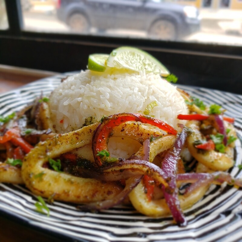 Sauteed calamari rings, sweet peppers, red onions garlic basil and parley, red pepper coulis,  rice pilaf. Gf, lf