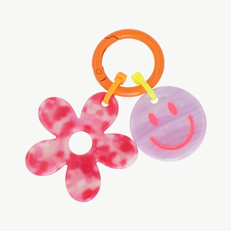 Schlüsselanhänger Smiley mit Blume pink / violett