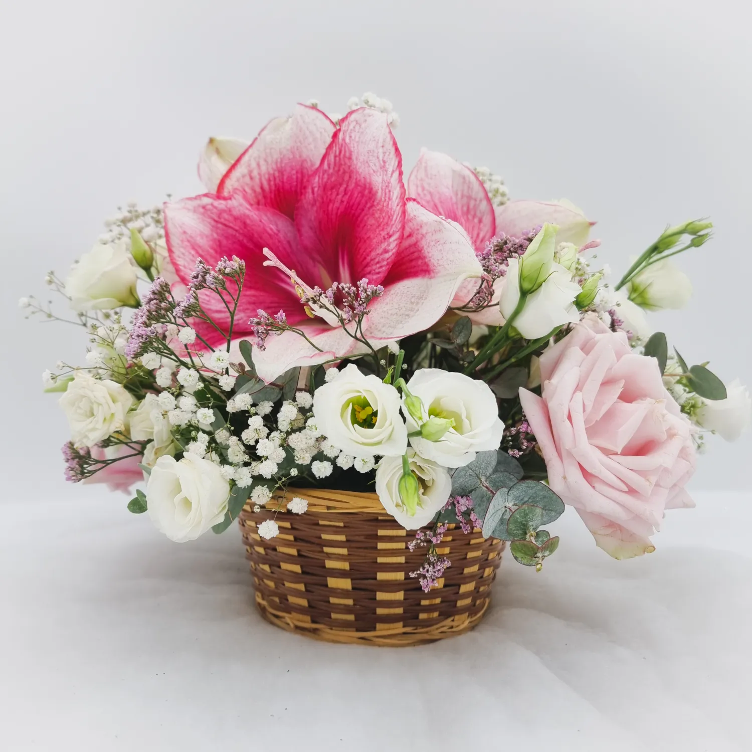 Basket of pink and white flowers