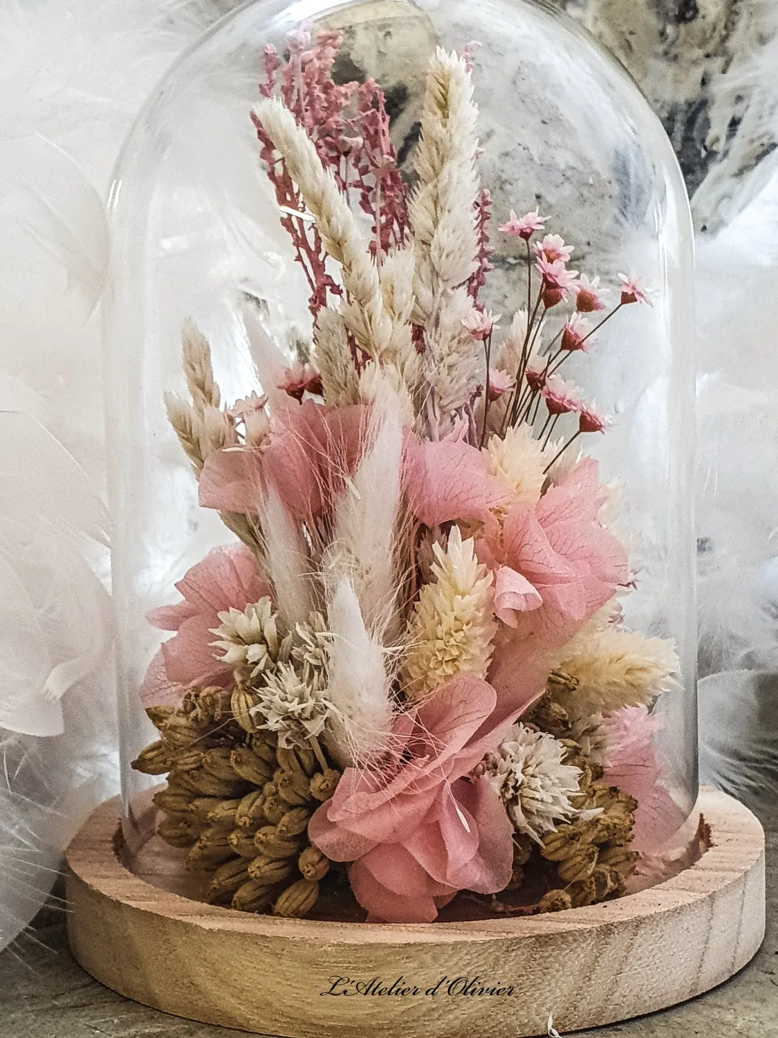 Dried flower arrangement under a glass dome. Soft pink and natural tones. Handmade.