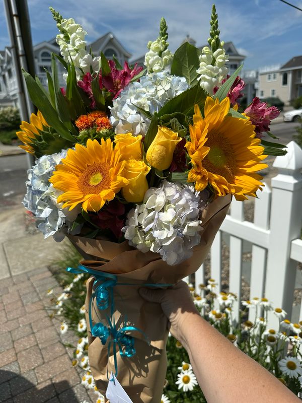 $100 Seasonal Wrapped Fresh Flower Bouquet (no vase)