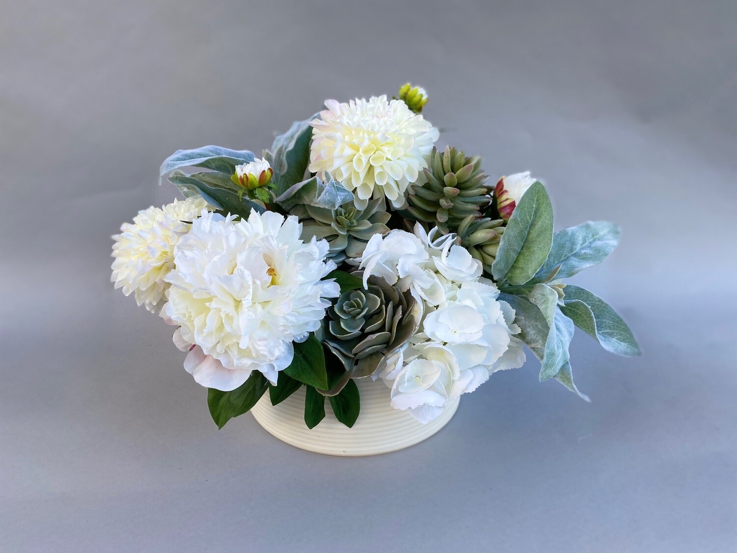 White Dahlias, Hydrangeas and Peonies with mixed Succulents in a White Ceramic
