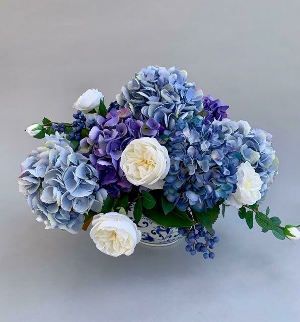 Mixed Blue and Purple Hydrangea with Roses and Berries in a Blue and White Vase