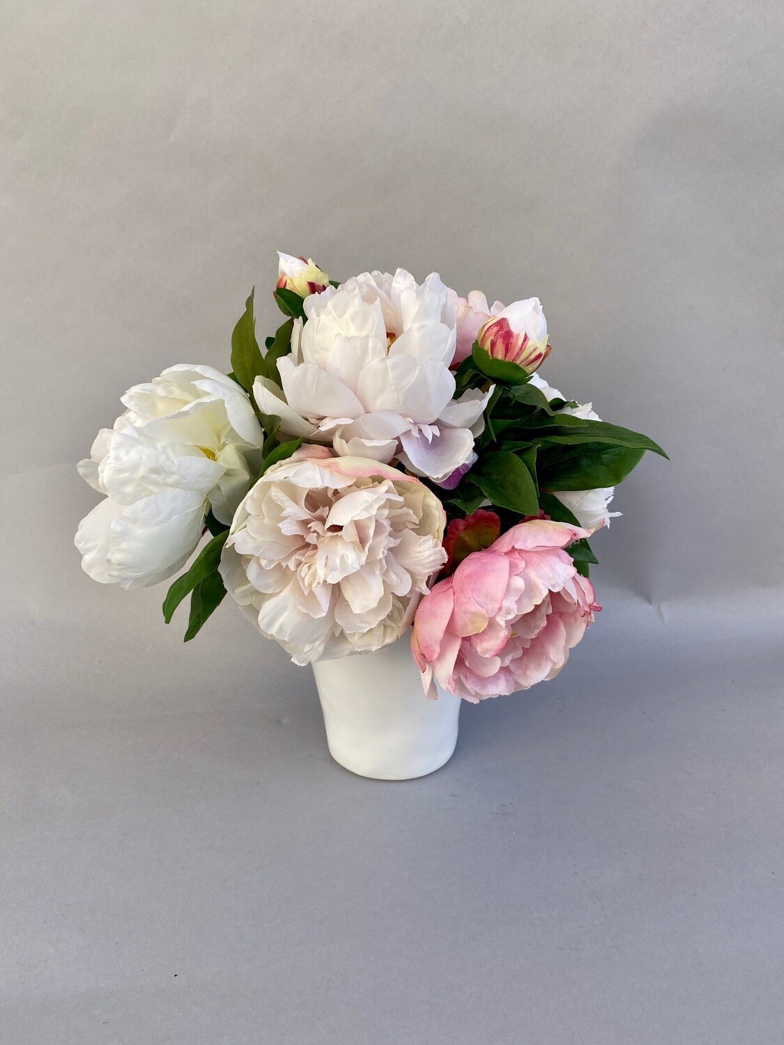 Mixed Pink Peonies in a White Ceramic Vase