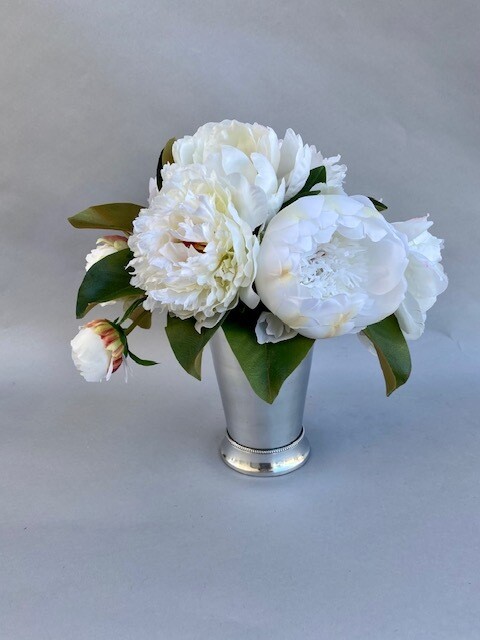 White mixed peonies in a silver julep cup vase
