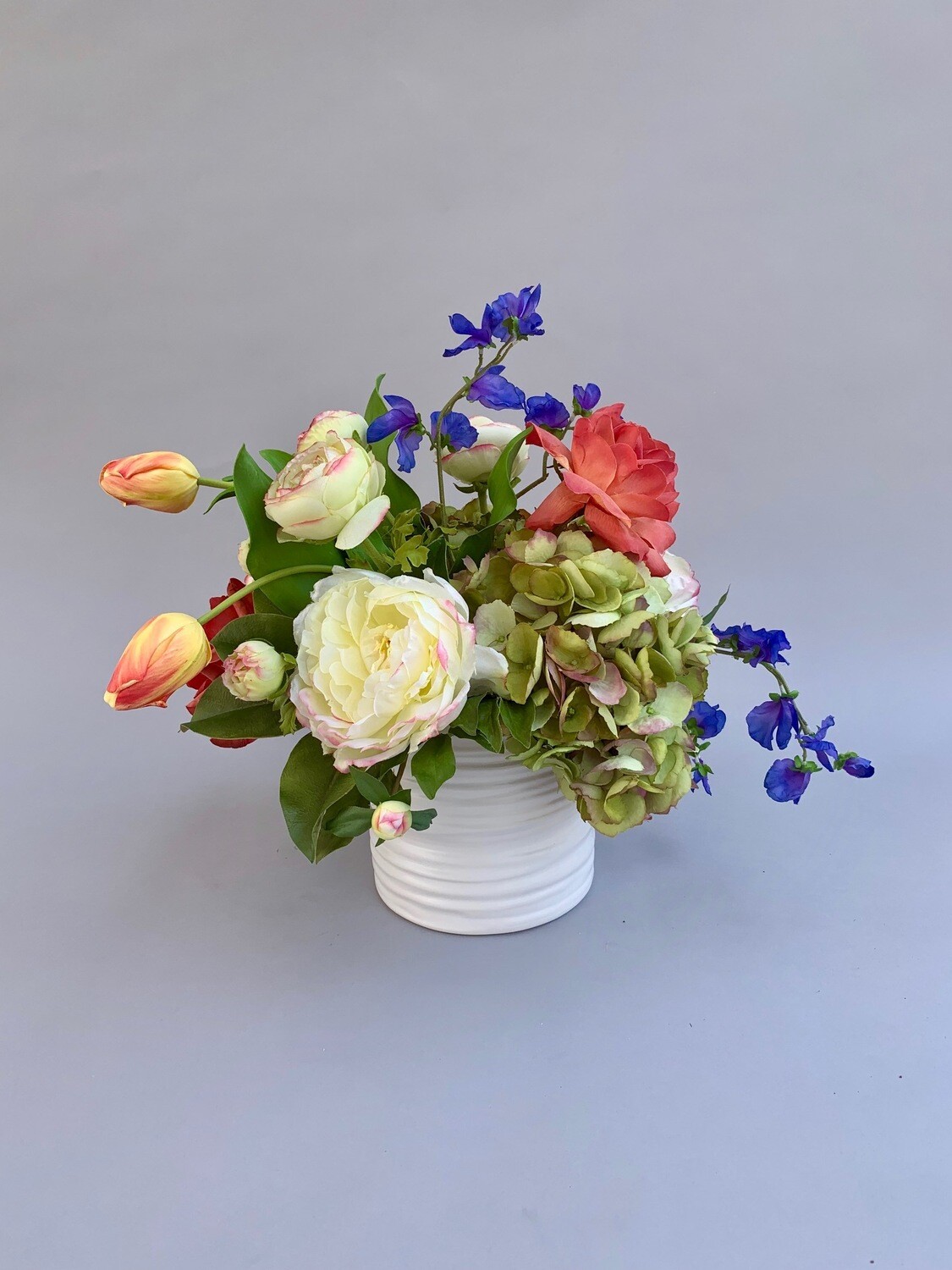 Peonies, Hydrangeas, Tulips, and Sweet Peas in a White Ceramic