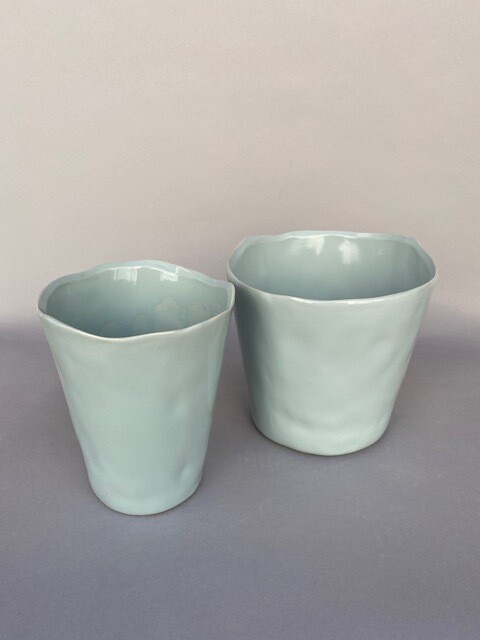Echeverias, sedum and ice plant succulents in a blue rippled edge ceramic