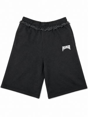 nine logo Shorts