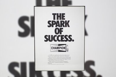 1984 Champion Spark Plugs - Success | Type Schrift