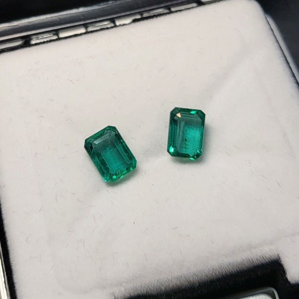 Emerald octagon cut pair 1.42 ct and 1.50 ct