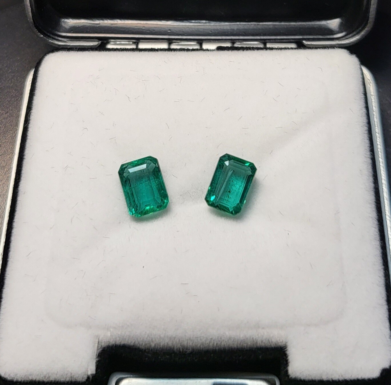 Emerald octagon cut pair 1.42 ct and 1.50 ct