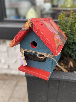 Small Blue and Red Birdhouse with orangeflower on top Small Blue and Red Birdhouse with orangeflower on top