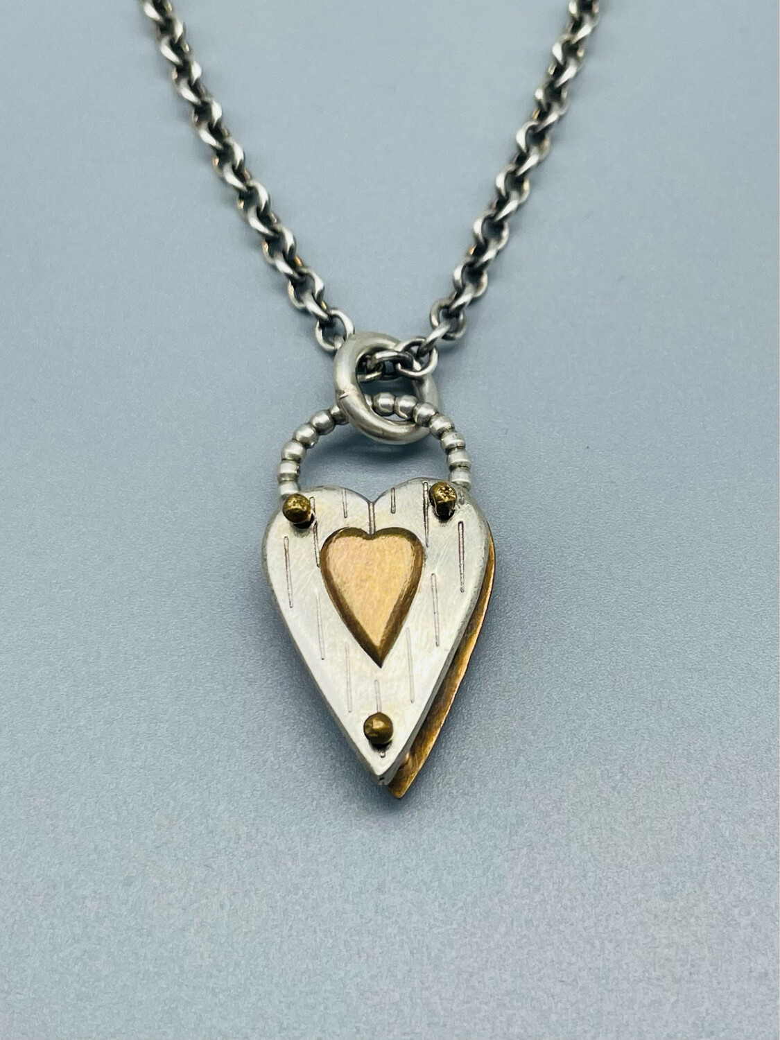 N464 Shadow Heart Necklace, Bronze/Sterling Silver, Thomas Mann, New Orleans, LA