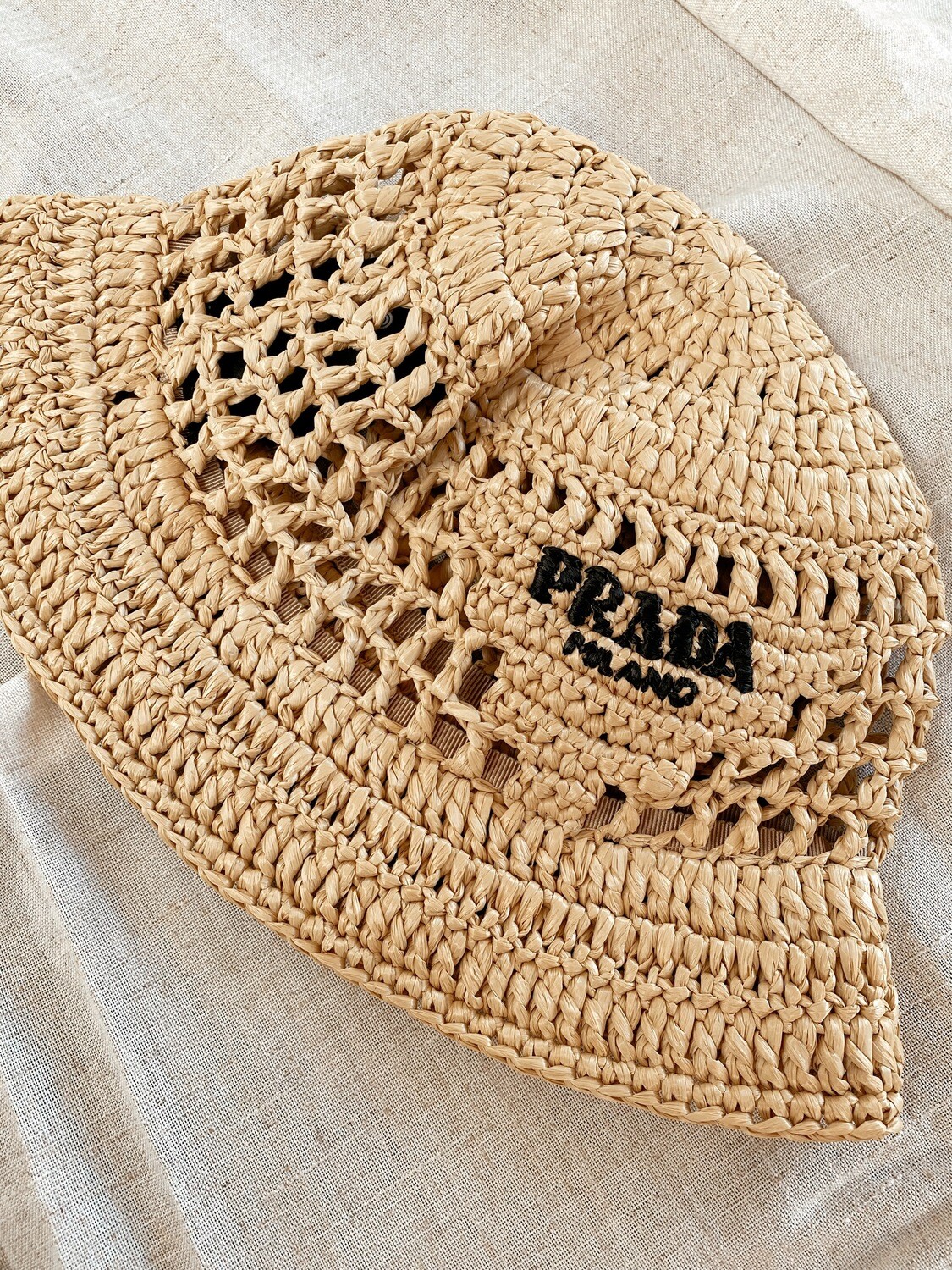 prada straw bucket hat